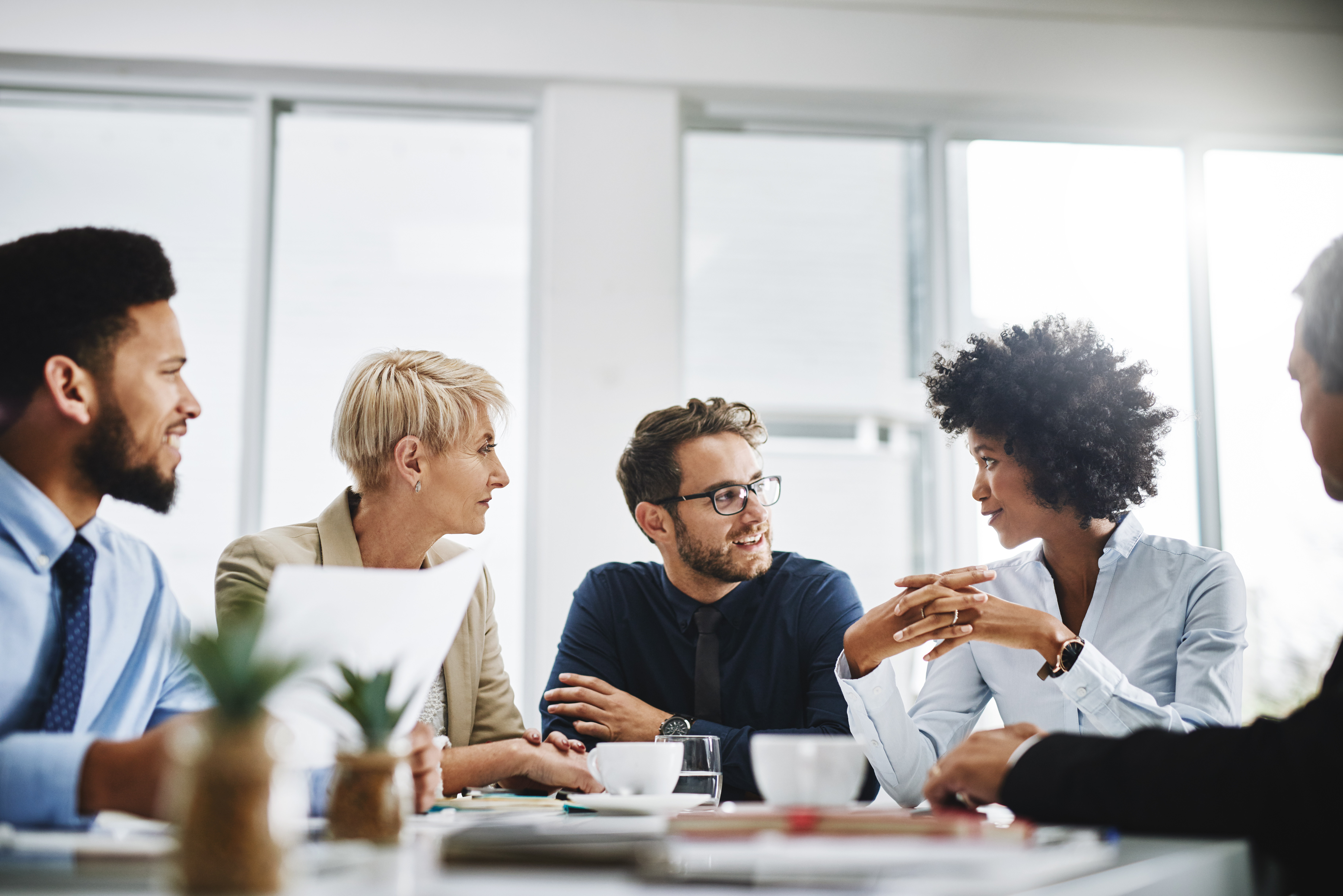 Picture of a group of people talking with each other.